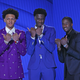 Paolo Banchero (L), Mark Williams (C), and Malaki Branham (R) pose for photos.